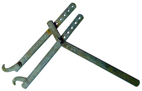 old metal tool with two hooked ends on adjustable lengths.